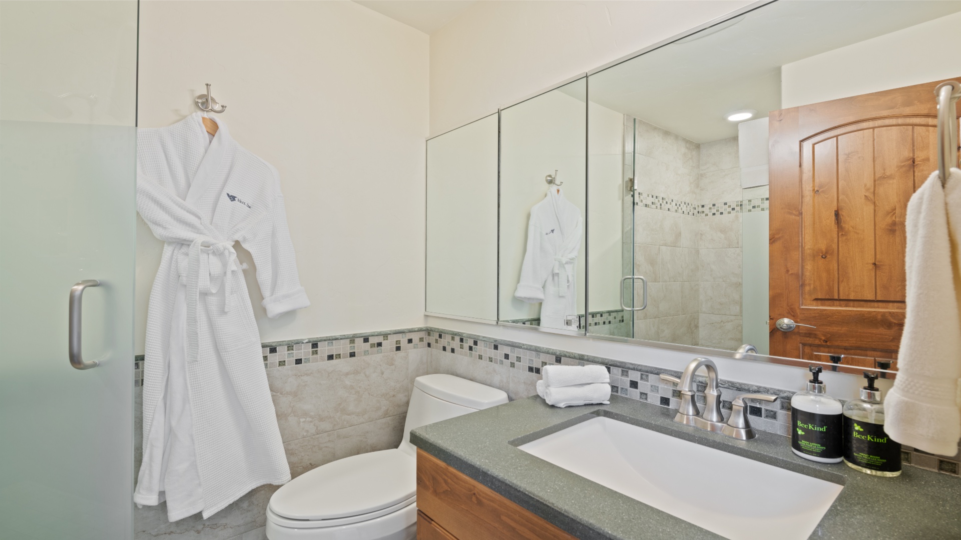 Step out of your shower into a plush robe and find everything you need for a refreshing start to your day in this well-appointed bathroom.