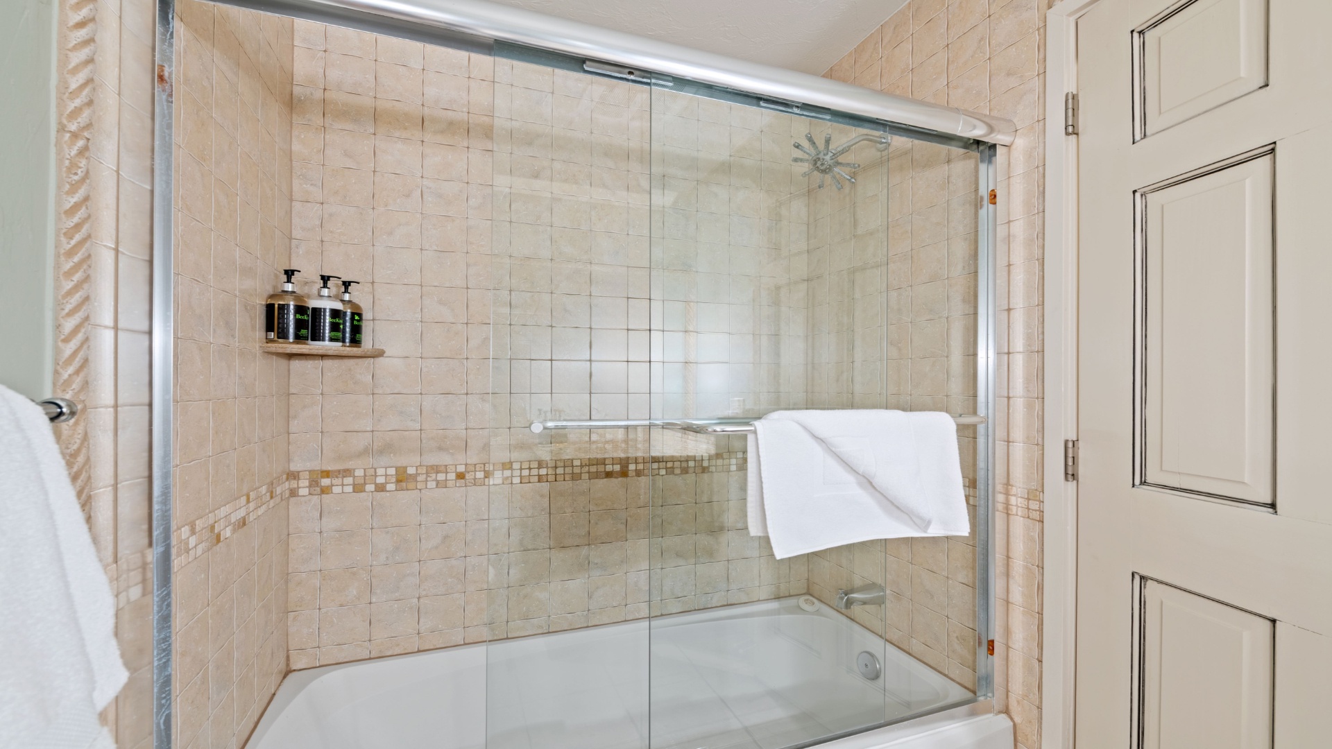 Step into your private spa-like retreat—fresh, bright, and beautifully tiled. You'll find plush towels waiting and plenty of room to refresh after your adventures.