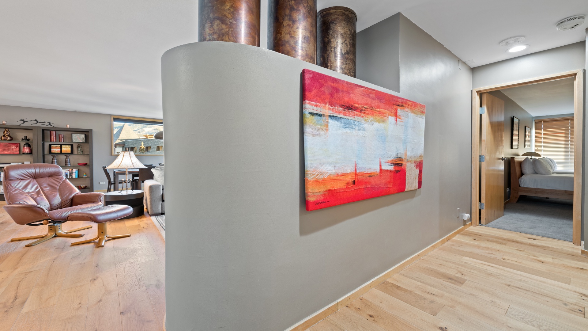 Step into your stylish retreat with modern art welcoming you. The open layout flows effortlessly from living room to bedroom, blending comfort and contemporary design throughout.