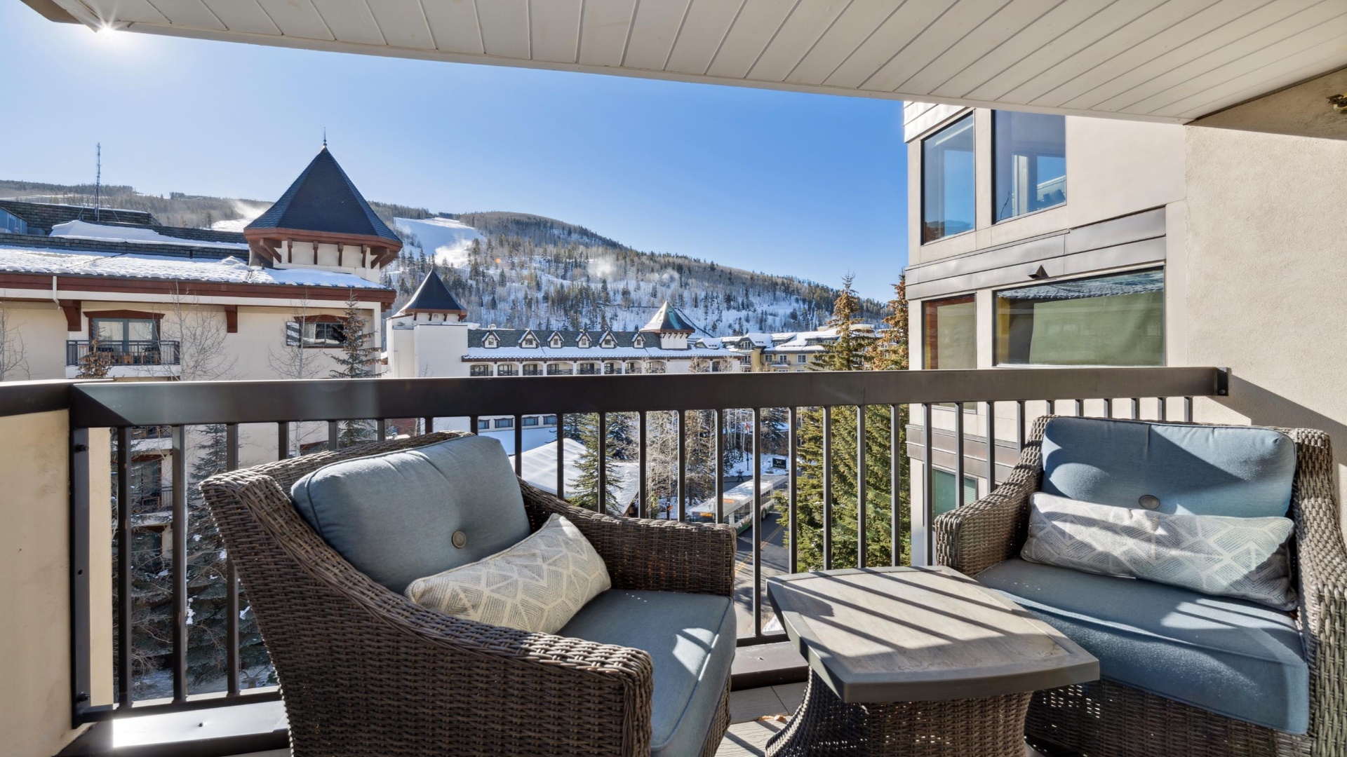 Sip your morning coffee on your private balcony as you gaze at snow-dusted alpine peaks and charming village rooftops. Two cozy chairs invite you to relax and soak in the crisp mountain air and stunning vistas.