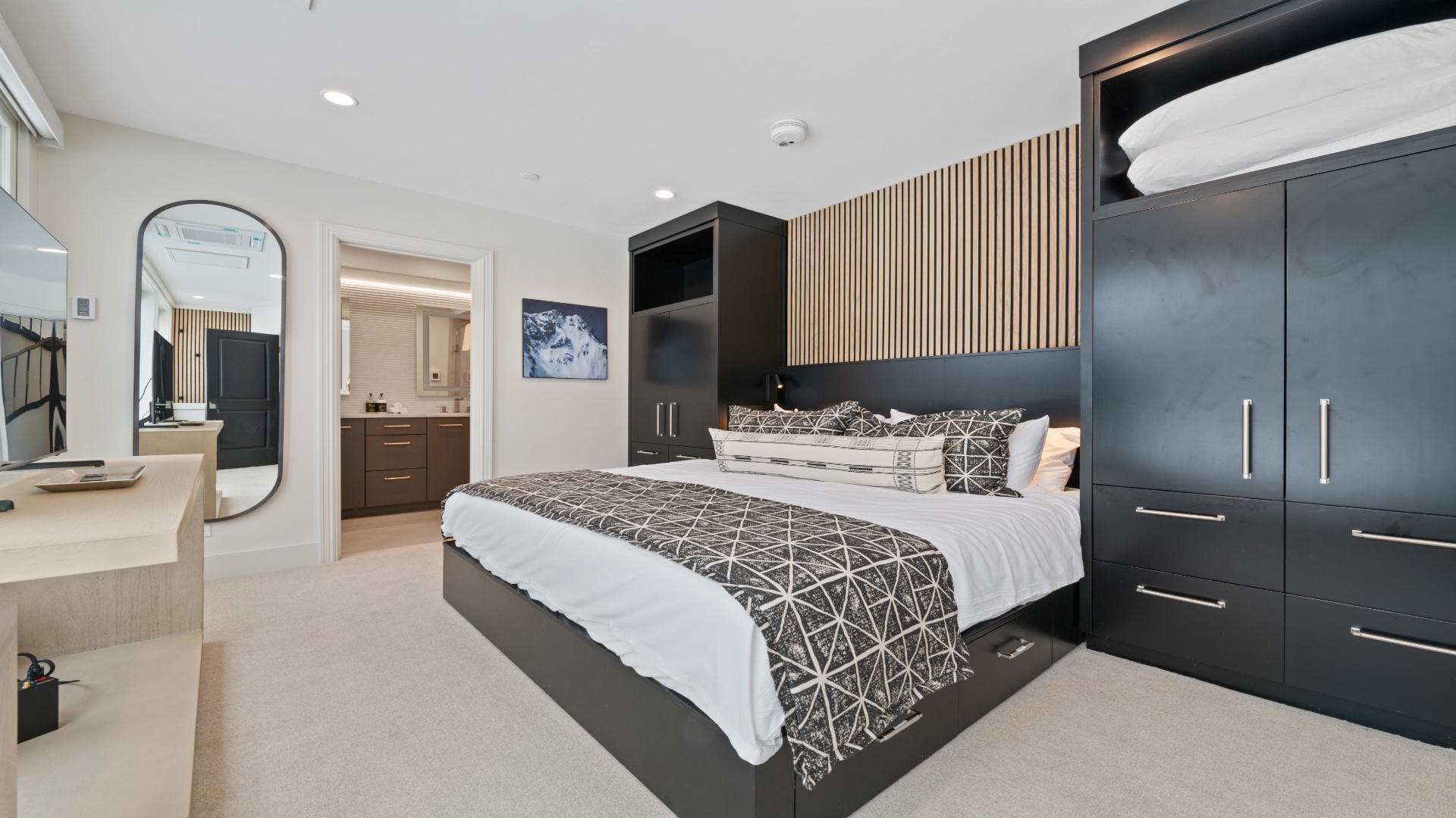 Sink into luxurious bedding and enjoy your private retreat, complete with elegant built-in storage and a stylish en-suite just steps away for your ultimate comfort.
