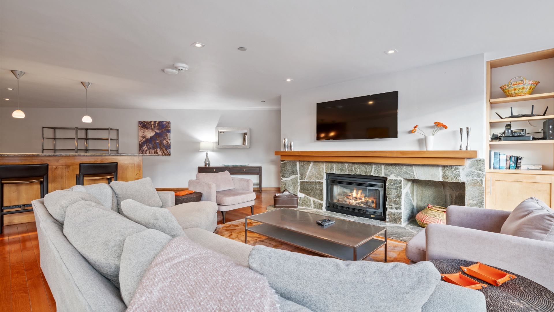 Sink into plush sofas by the stone fireplace, gather around the warm glow with loved ones, and stream your favorites on the large flat-screen. Your perfect retreat awaits.