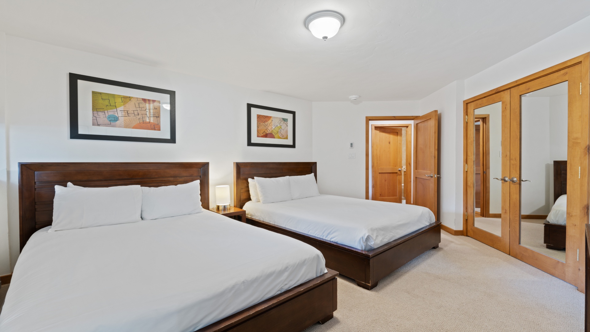 Sink into plush beds in your spacious retreat, where tasteful artwork and warm wood tones create a calming sanctuary for restful nights.
