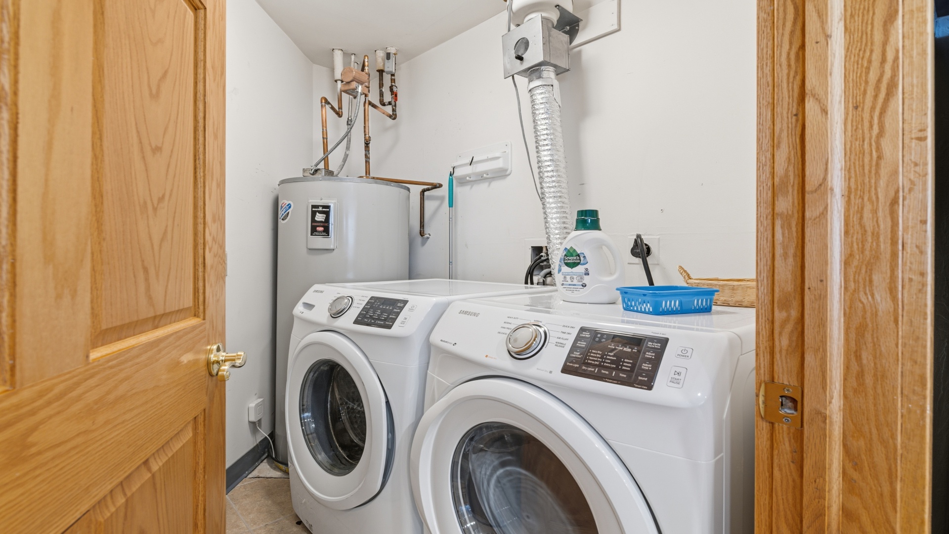 This dedicated laundry closet includes a front-loading washer and dryer, plus a water heater for your convenience. Fresh linens and easy cleaning are always within reach during your stay.