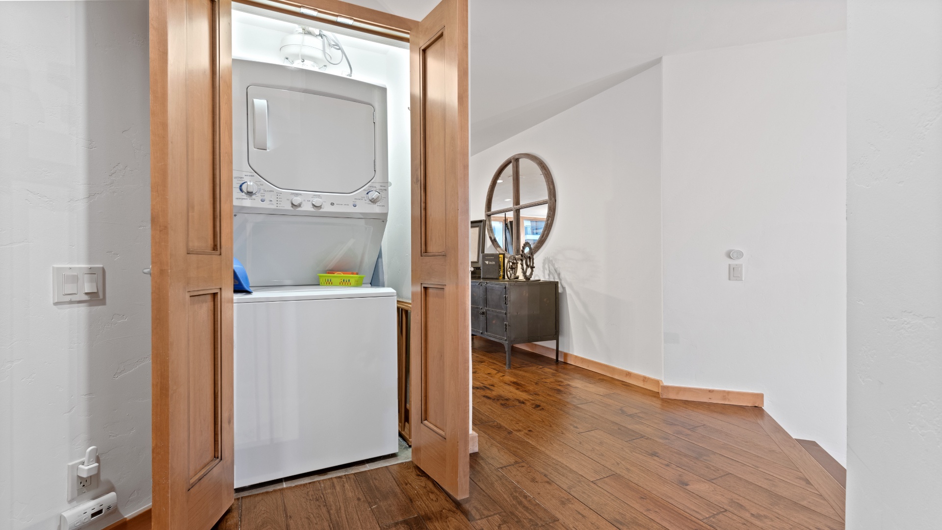 Your convenience is covered with an in-unit washer and dryer tucked behind elegant wood doors, so you can pack light and keep fresh throughout your stay.