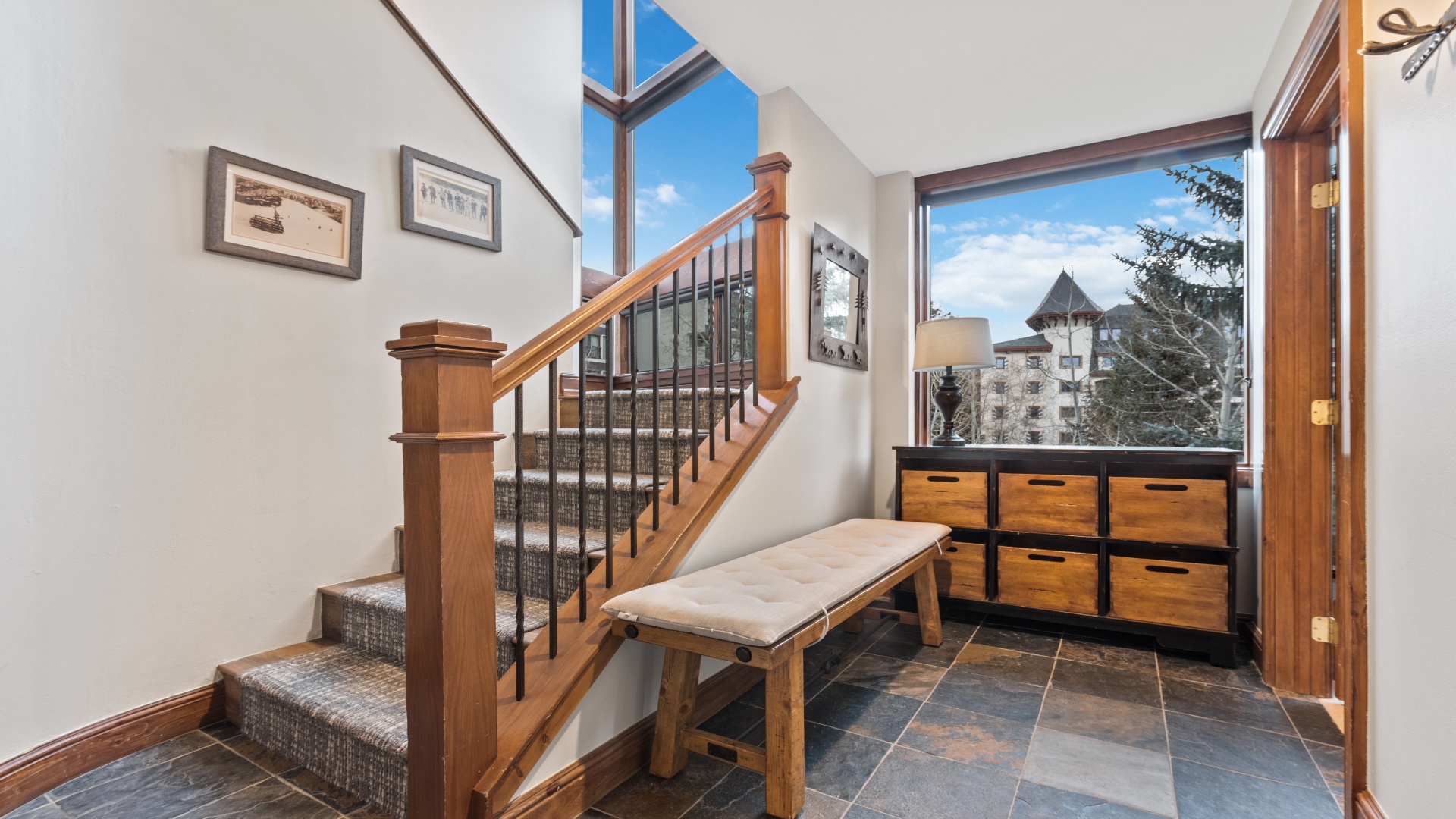Step through the door into your inviting entryway, where mountain views greet you through large windows and a skylight bathes the space in natural light.