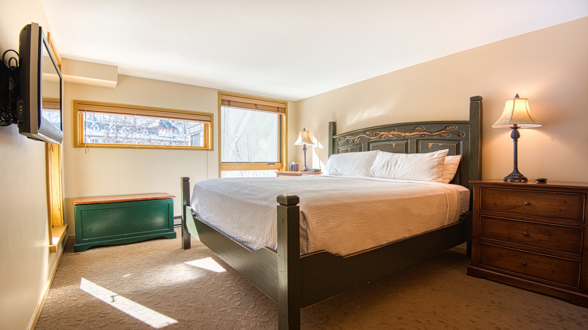 Sink into crisp linens and wake to soft natural light streaming through your windows. Your peaceful bedroom retreat features elegant furnishings and warm touches for a restful stay.