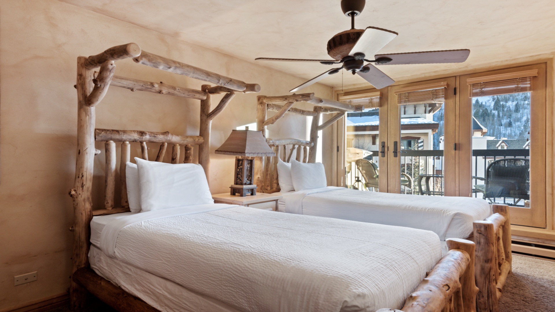 Wake up in your cozy mountain retreat, where rustic charm meets crisp linens and sweeping alpine views—step onto your private balcony and breathe in the fresh mountain air.