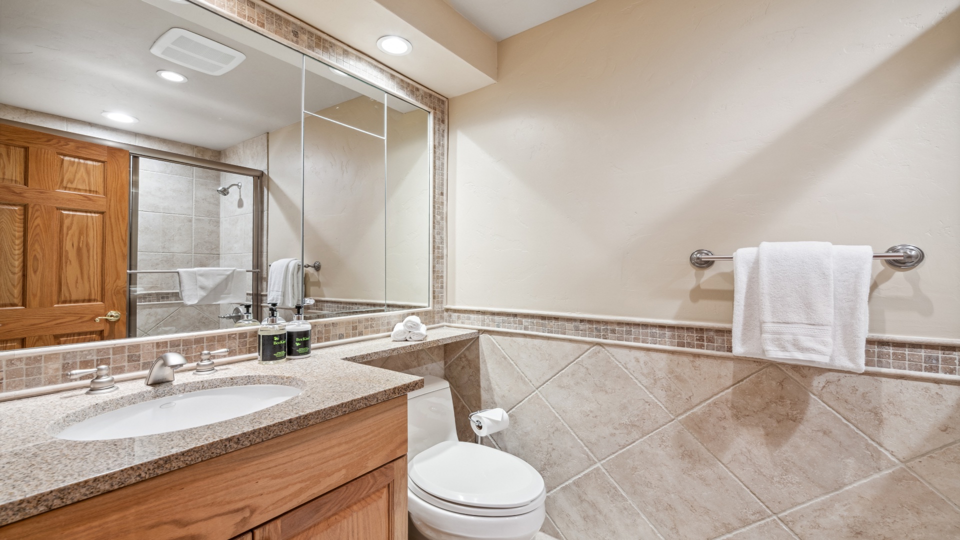 Freshen up in your private bathroom with a spacious walk-in shower, granite counters, and plush towels waiting for you.