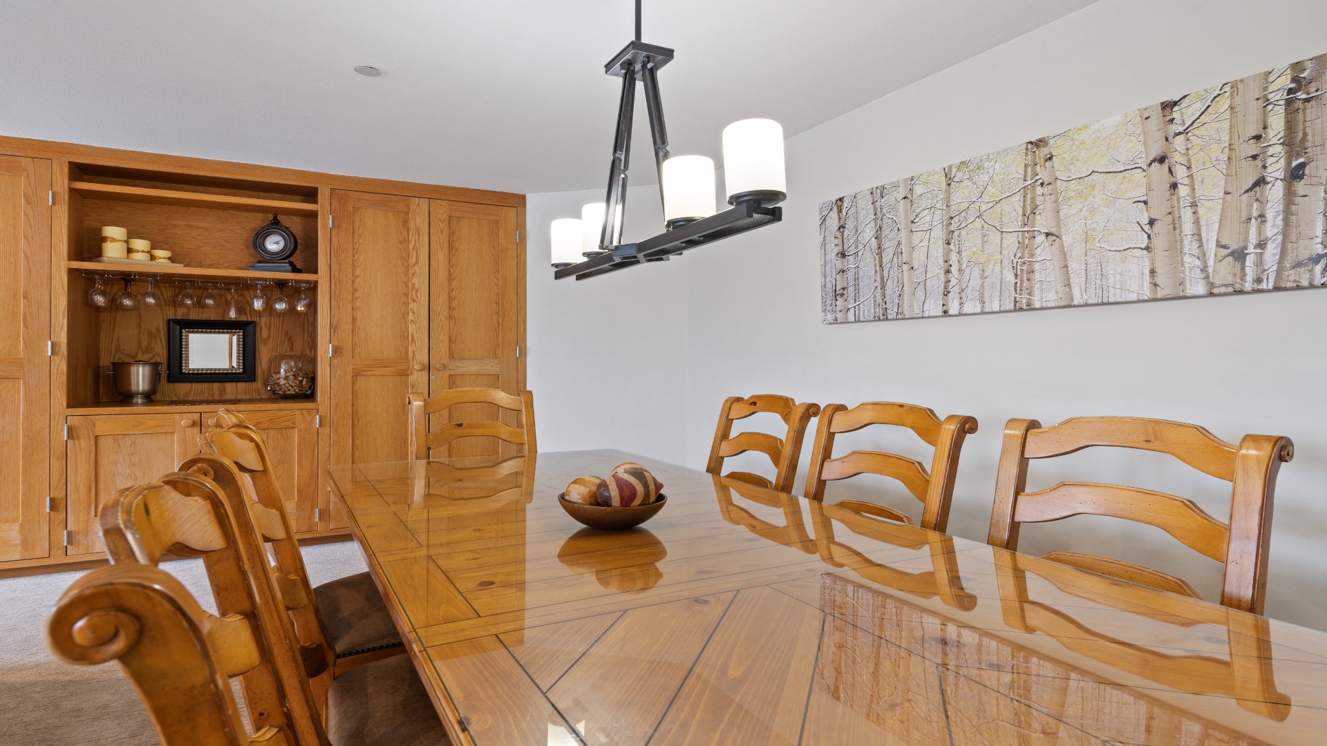 Gather around this inviting dining table, where warm wood tones and rustic charm create the perfect setting for your meals and memories together.