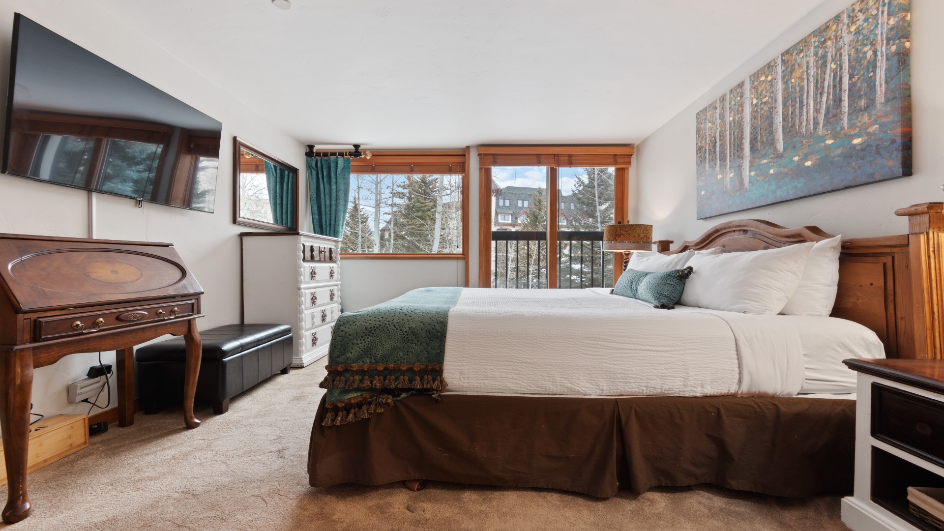 Your cozy mountain bedroom features a plush bed with forest views through large windows, creating your perfect winter retreat with rustic warmth and modern comfort.