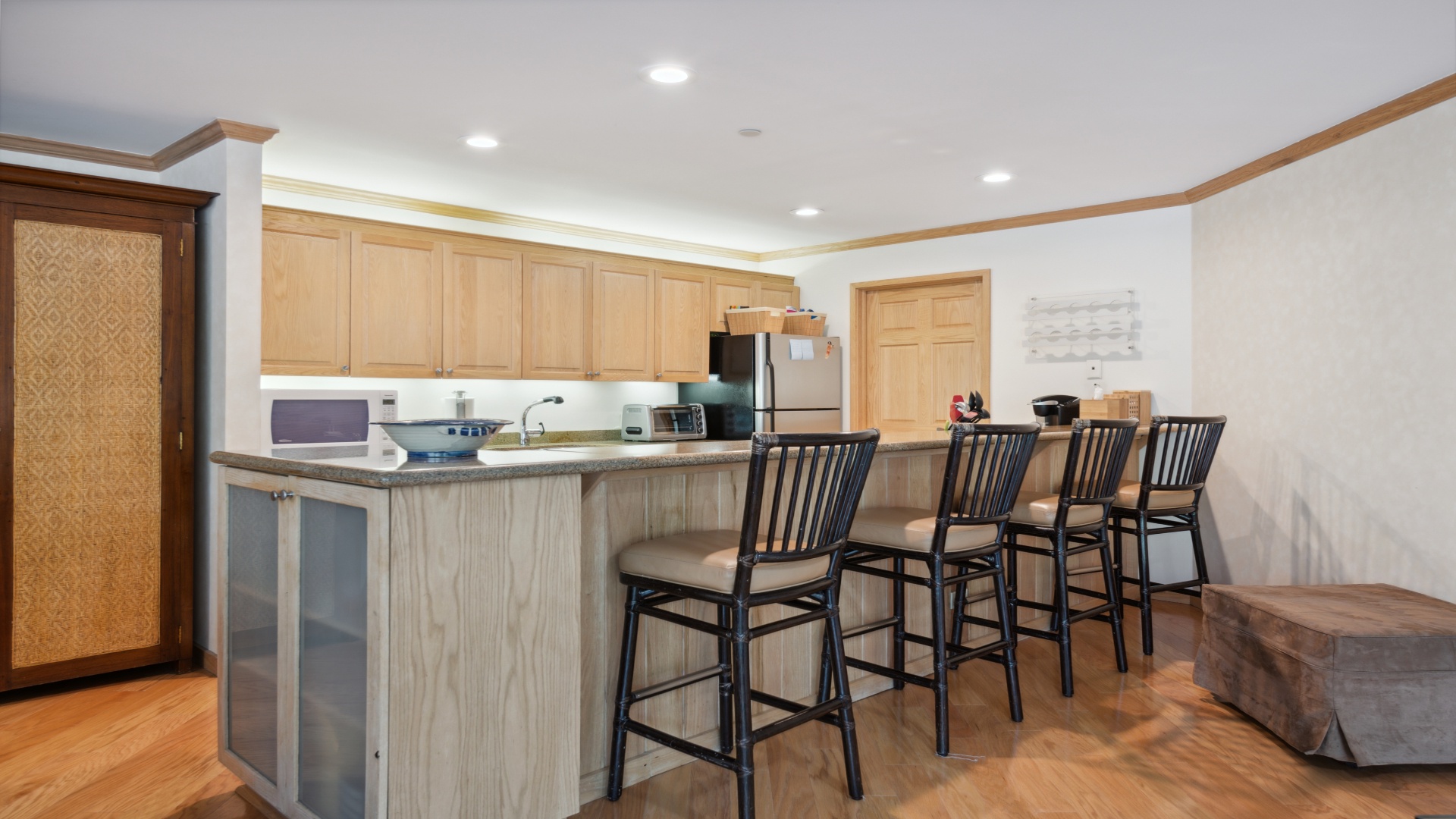 Gather around this spacious kitchen island with seating for four, where you can enjoy morning coffee or prepare meals with modern appliances at your fingertips.