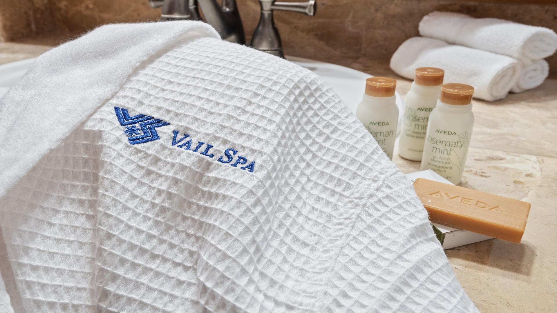 A curated collection of spa essentials awaits you on the vanity—plush towels, premium toiletries, and everything you need to unwind and refresh.