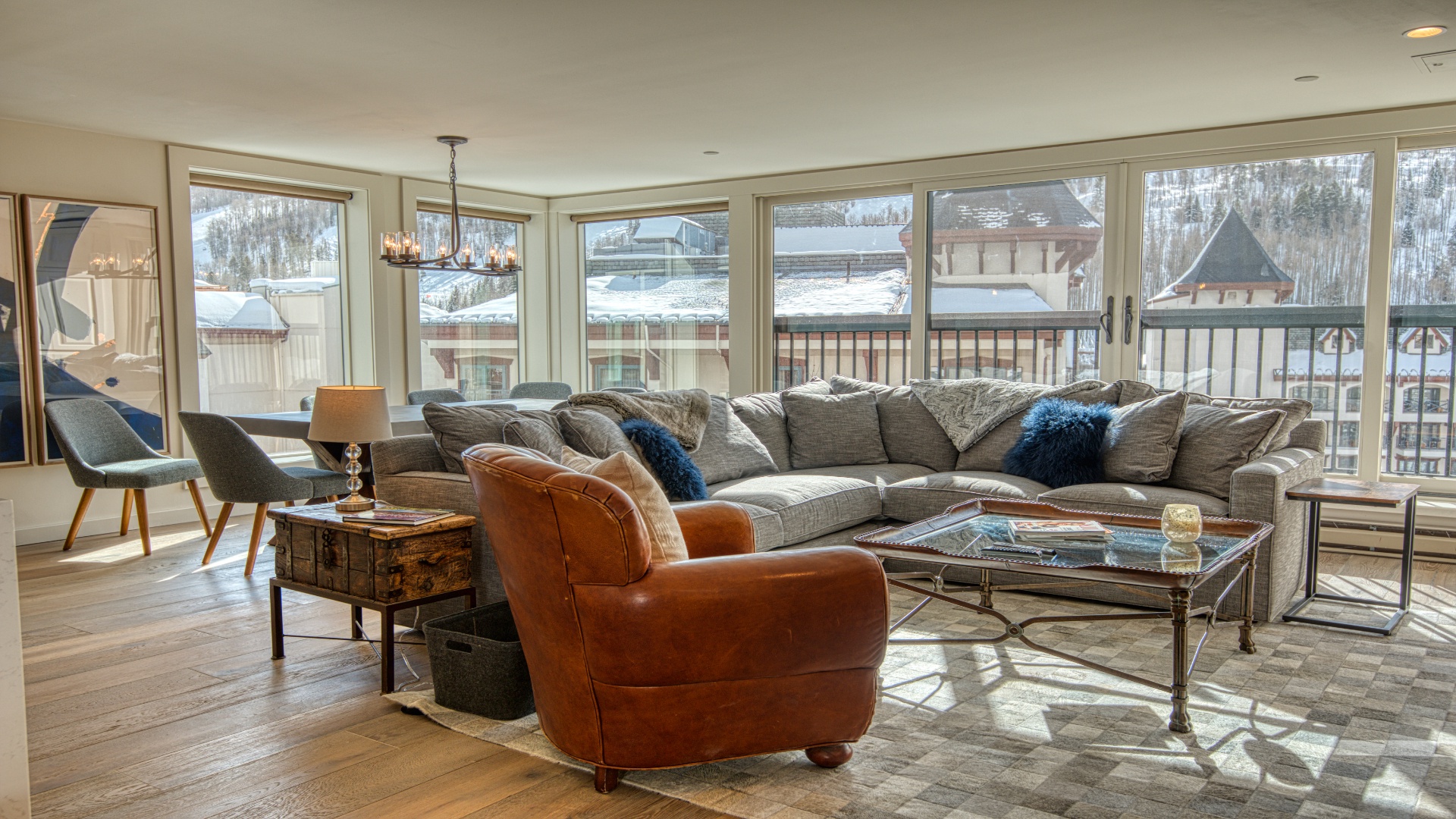 Sink into plush seating and gaze out at stunning snow-dusted mountain views. This inviting living room is your perfect retreat for après-ski relaxation.