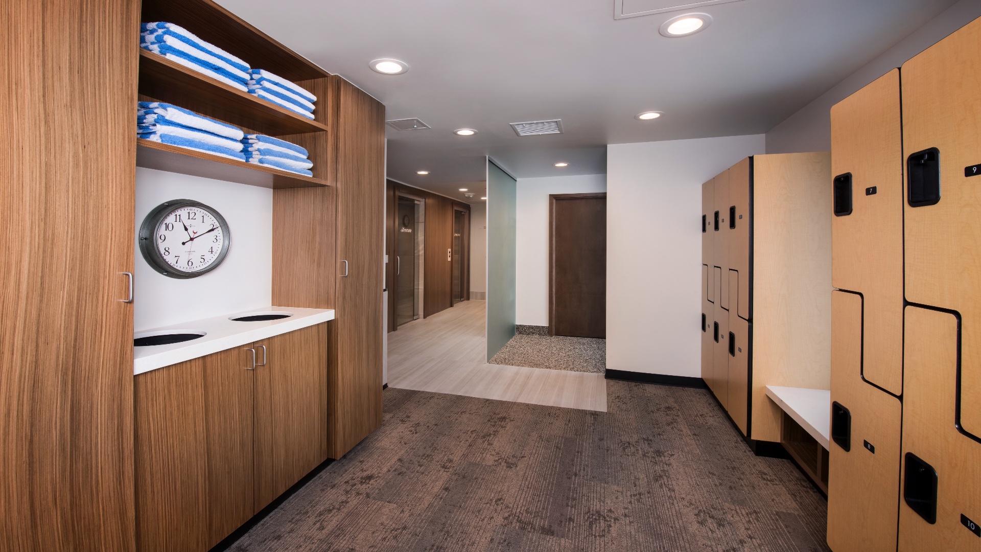A welcoming space featuring personal storage lockers, fresh towels, and thoughtful amenities awaits you—perfect for settling in and making yourself at home.