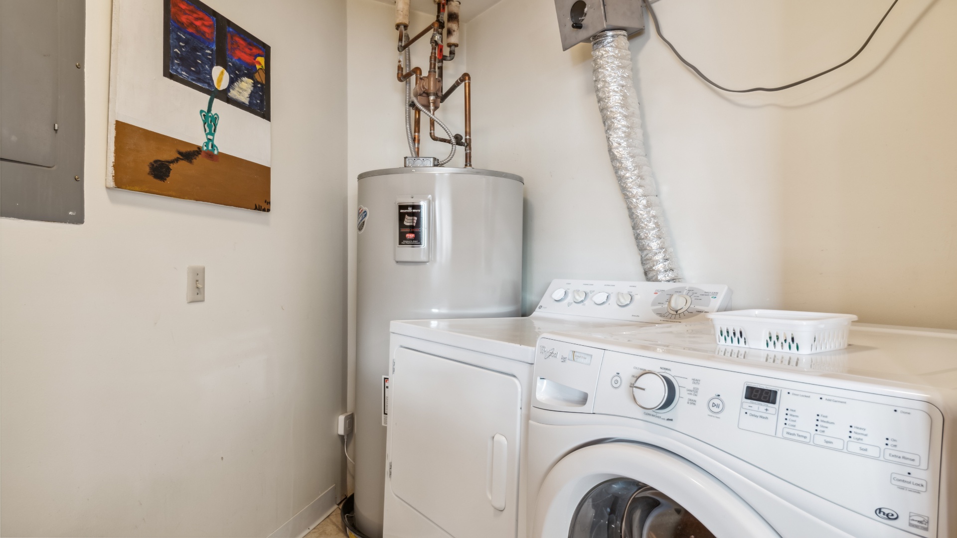 Dedicated laundry area with full-sized washer and dryer keeps your wardrobe fresh throughout your stay, adding convenience to your home-away-from-home experience.