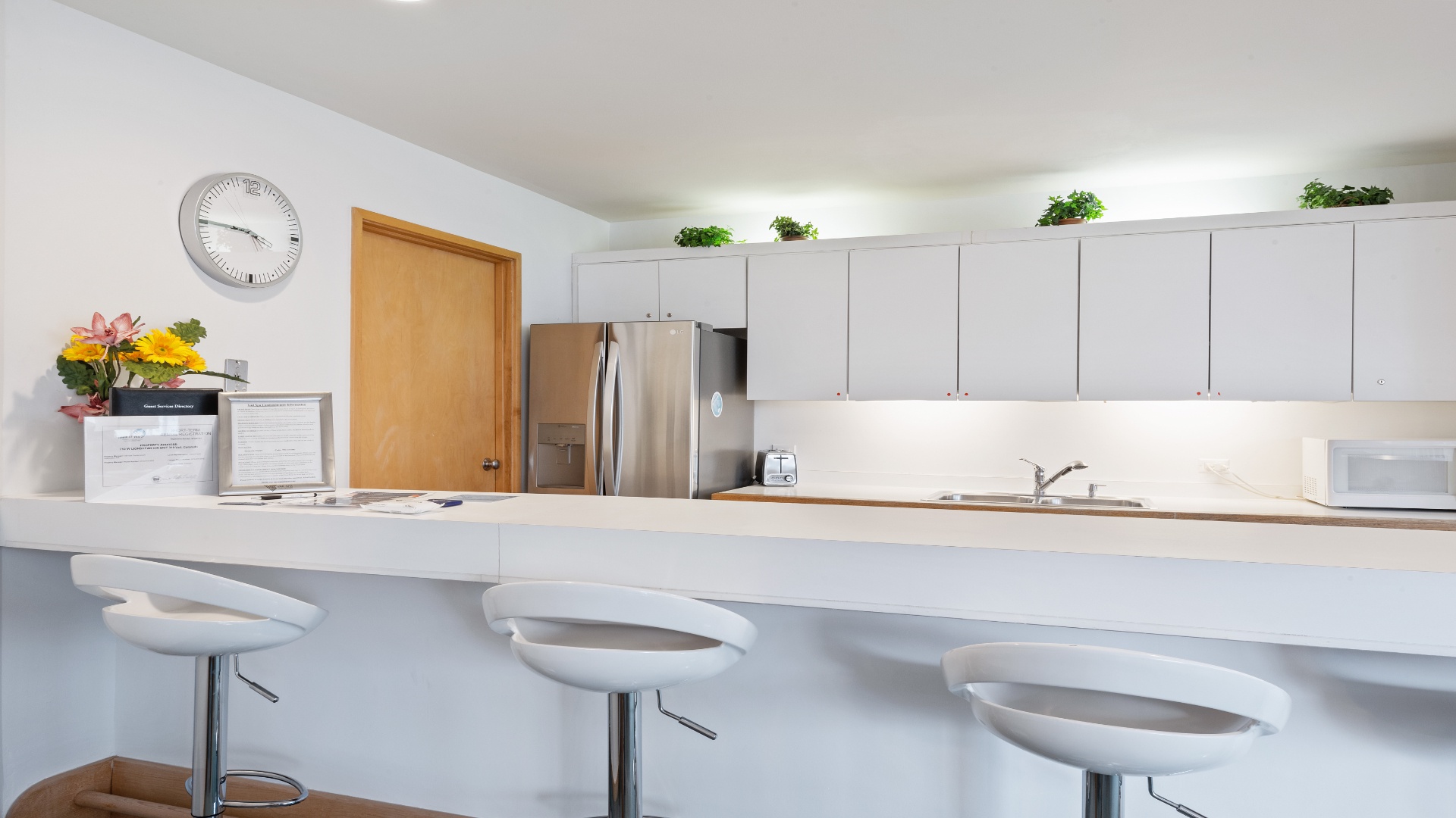 Your modern kitchen invites easy meal prep with sleek counters, stainless steel appliances, and casual breakfast bar seating for morning coffee and conversation.