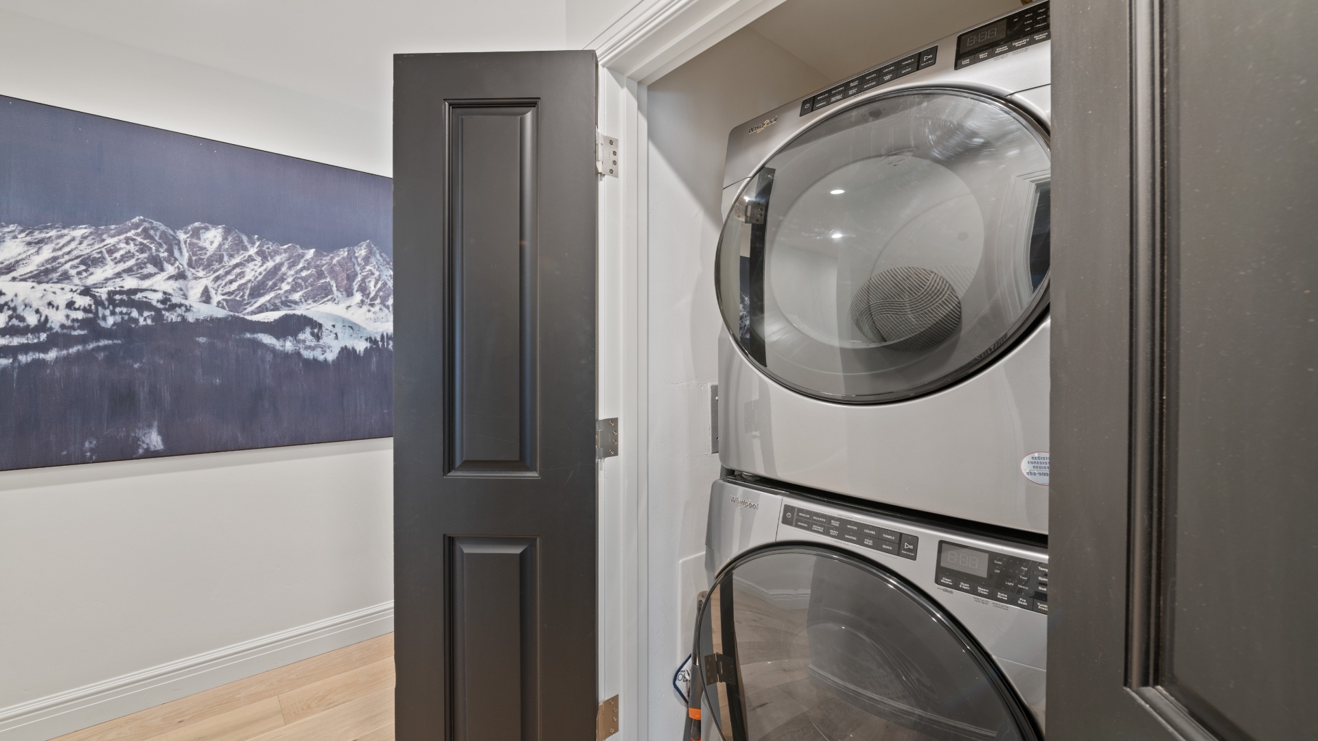 Modern stacked washer and dryer in your private laundry closet makes it easy to refresh clothes anytime during your mountain getaway.