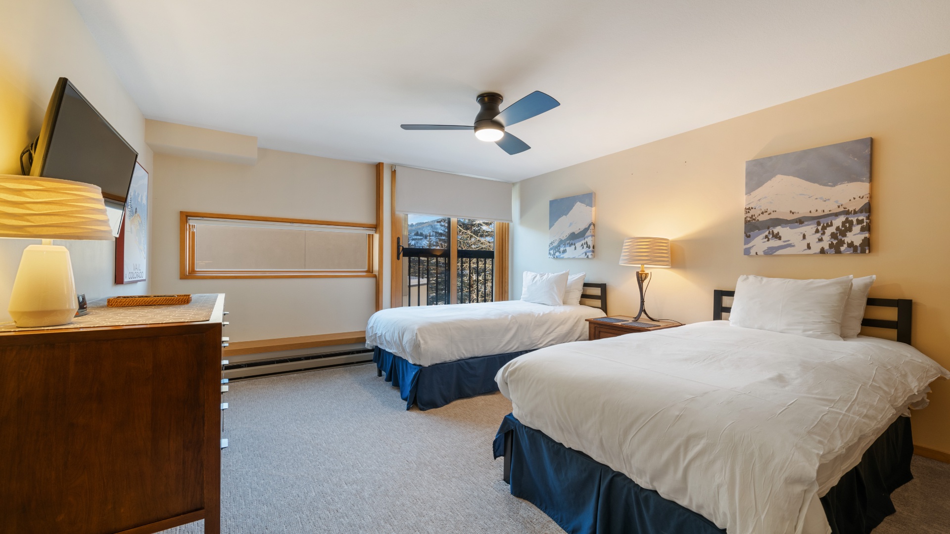Unwind in your spacious retreat with two plush beds, mountain views through the window, and crisp linens awaiting your arrival. Perfect for restful evenings after adventures.