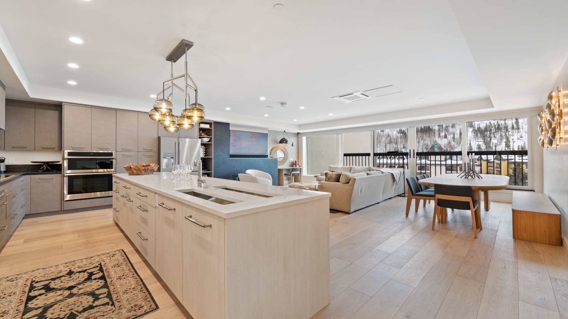 Imagine gathering in this open-concept space with sleek modern kitchen, inviting living area, and dining nook—all framed by stunning mountain views you'll wake up to each morning.