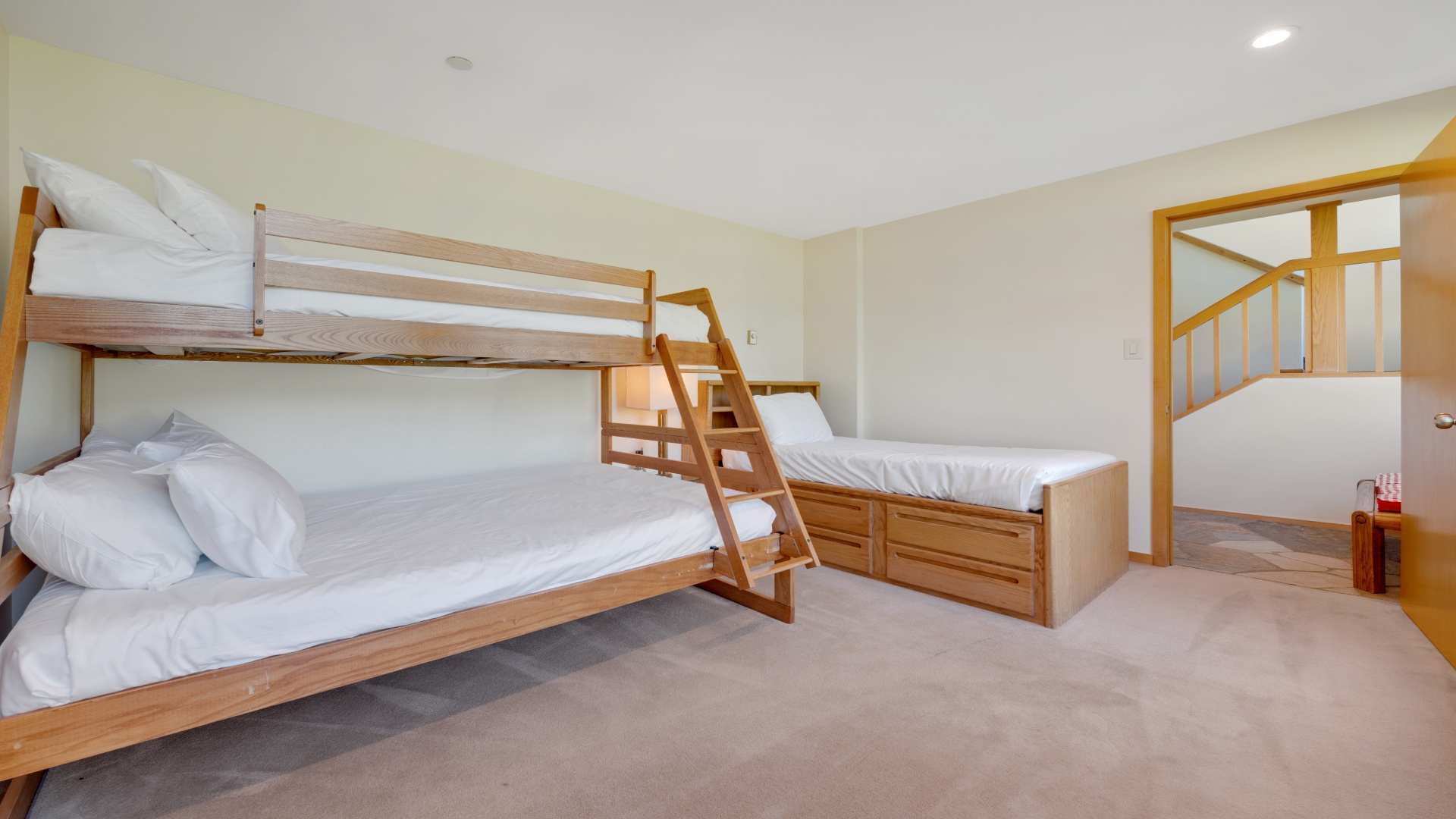 Your kids' bunk room awaits! This bright, spacious bedroom features a cozy bunk bed and twin setup—perfect for group stays or families traveling together.