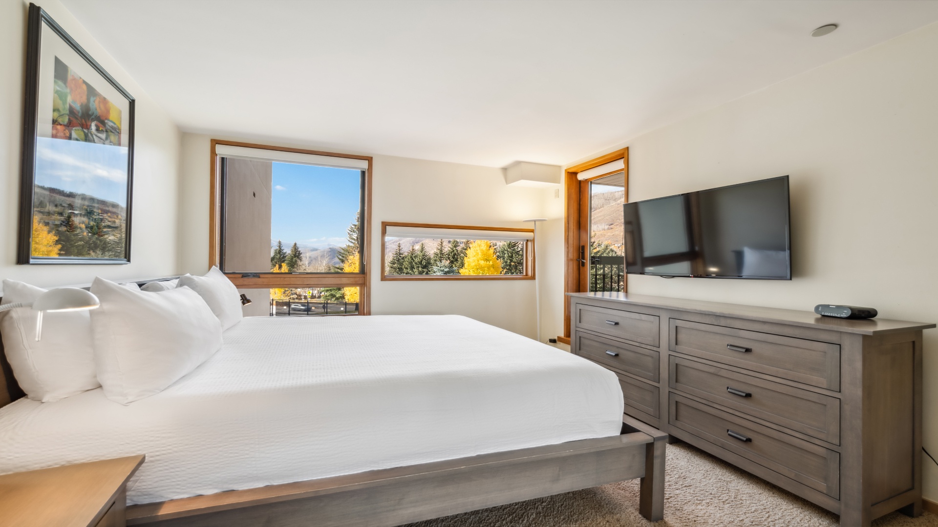 Wake up to stunning mountain and autumn foliage views from your cozy bedroom, complete with modern amenities and a private balcony for your morning coffee.