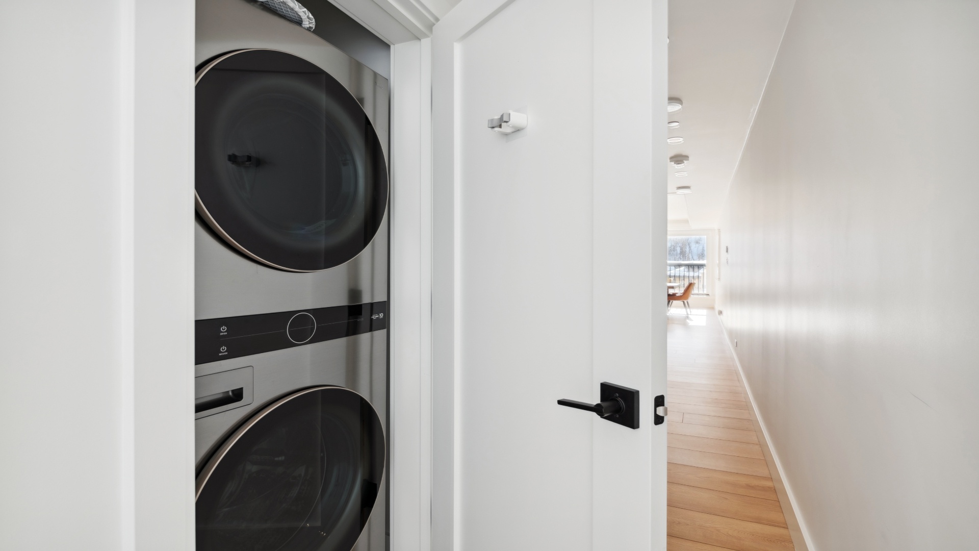 Your stay includes the convenience of an in-unit washer and dryer tucked neatly into a closet, so you can pack light and refresh your clothes anytime.