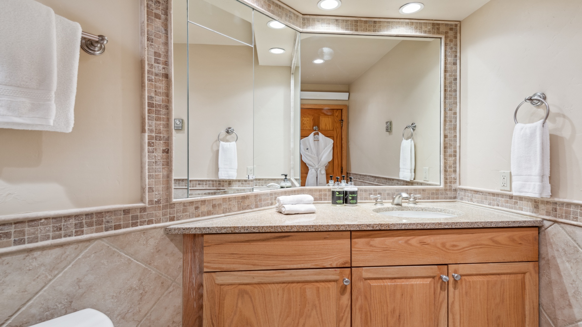 Your spacious bathroom features elegant tile accents, plush towels, and thoughtful amenities to help you refresh after a day of adventure.