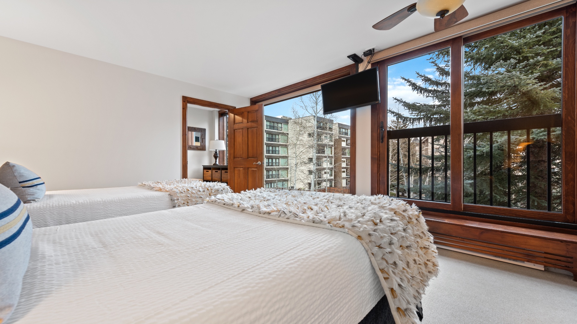 Wake up to crisp mountain air and tall pines framing your window. Slip into soft bedding, let the light pour in, and breathe easy in your tranquil retreat.