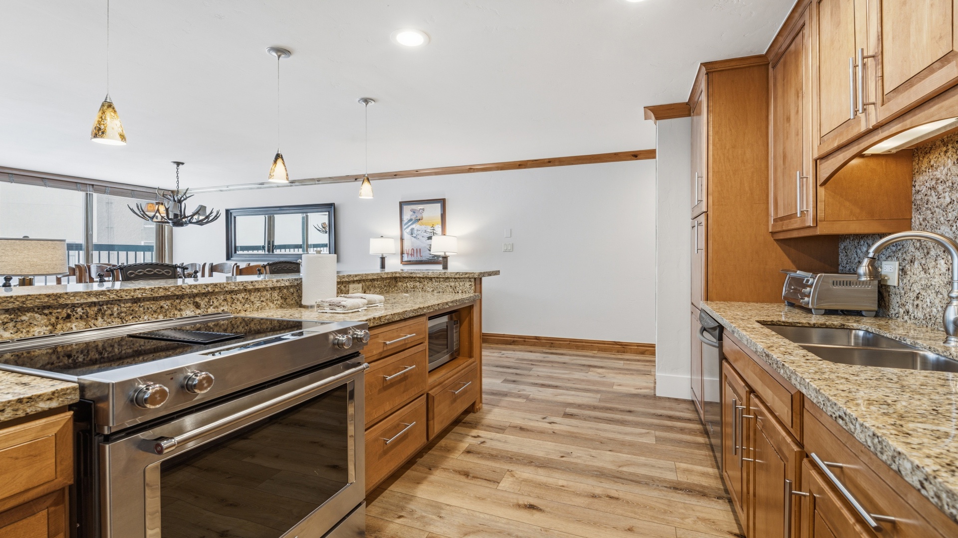 Your spacious gourmet kitchen features granite countertops, stainless appliances, and warm wood cabinetry—perfect for preparing memorable meals during your mountain getaway.