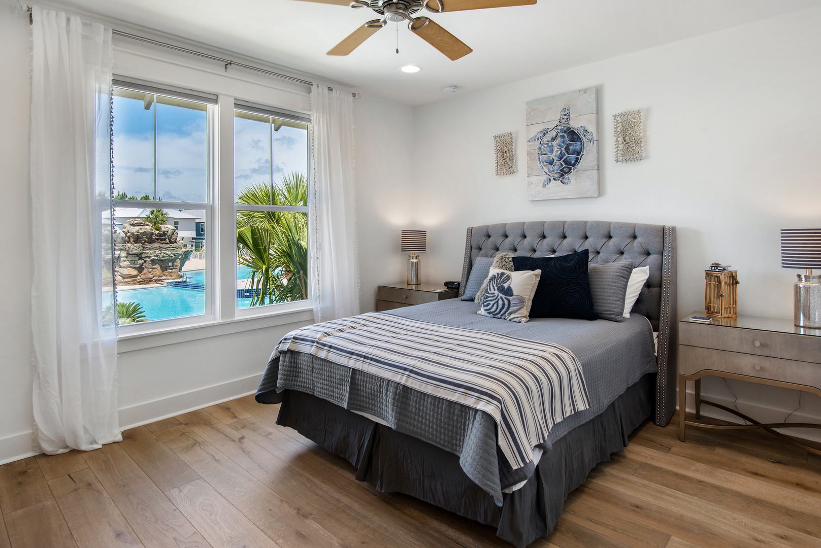 The second upstairs bedroom features a queen-bed and amazing pool views!