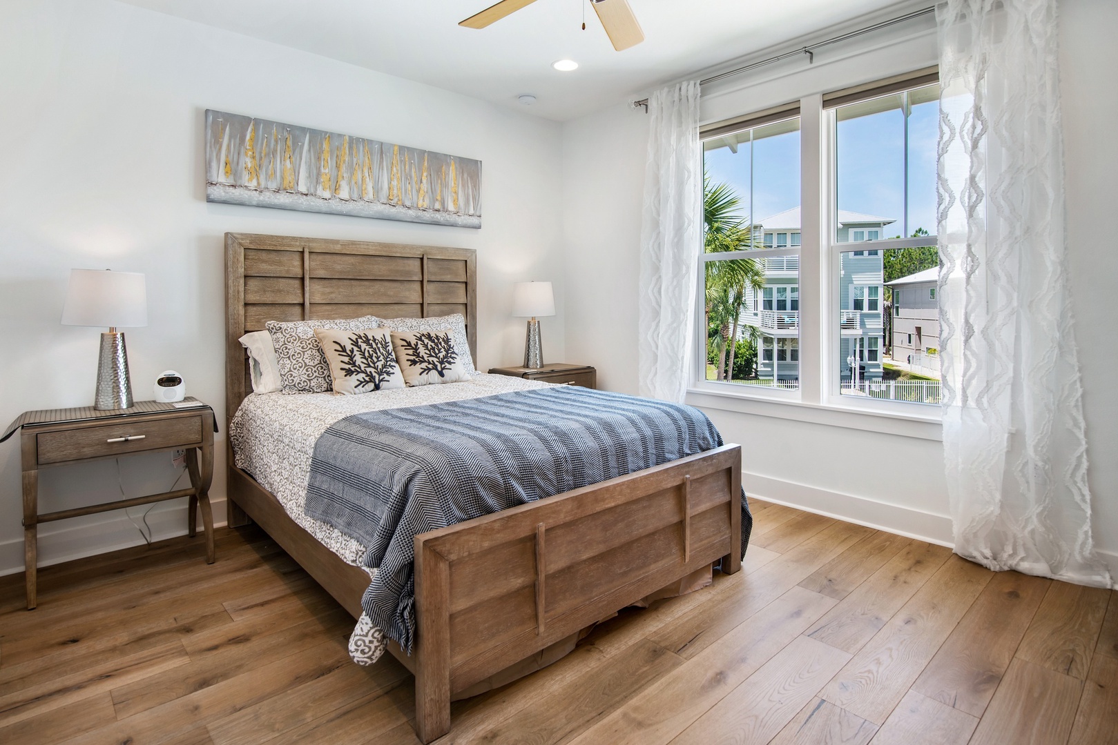 The first upstairs bedroom features a queen-bed and amazing pool views!