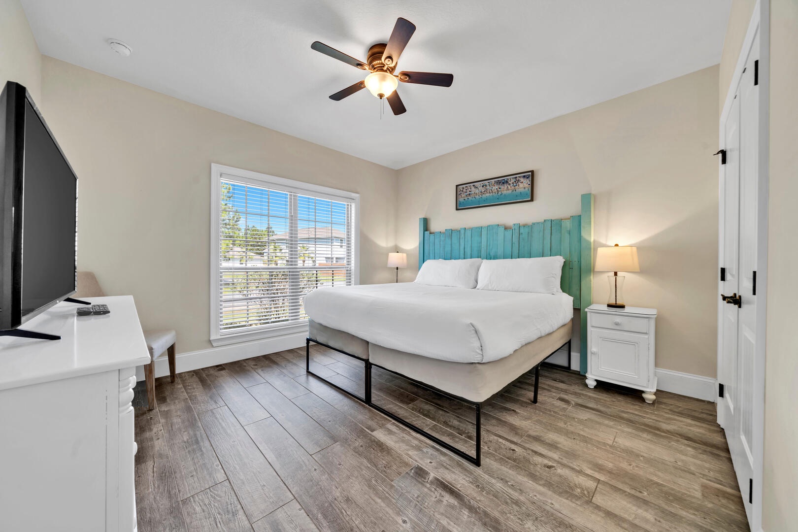 The guest bedroom features a king size bed and plentiful light!
