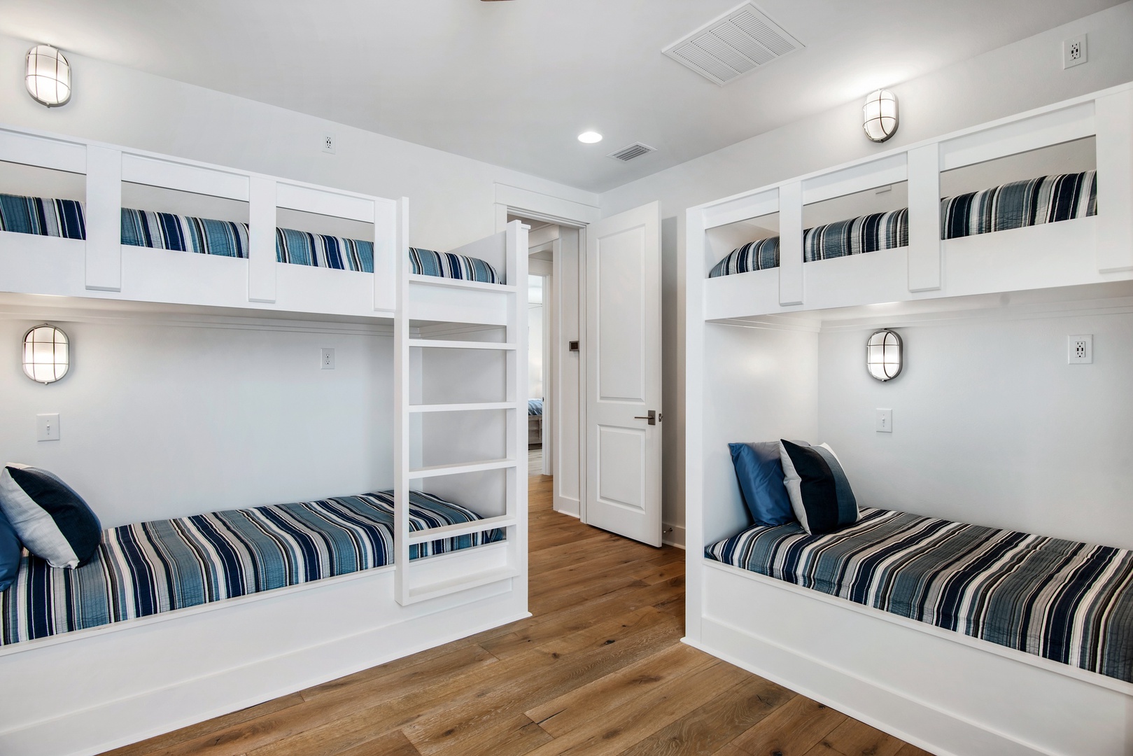 The bunk room offers nautical finishes, and great reading spaces for kids and adults!