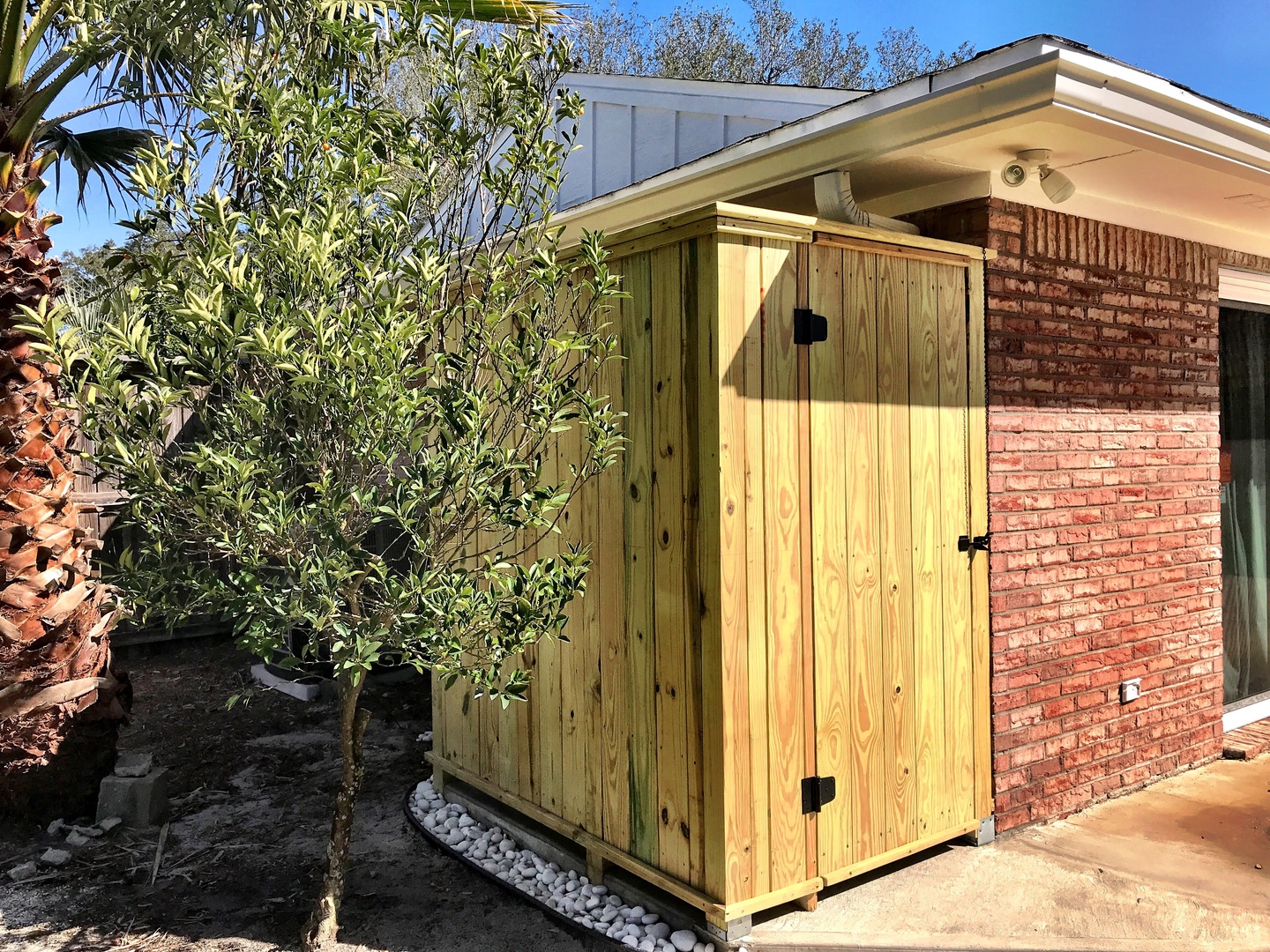 You'll love the outdoor hot shower with privacy enclosure/door!
