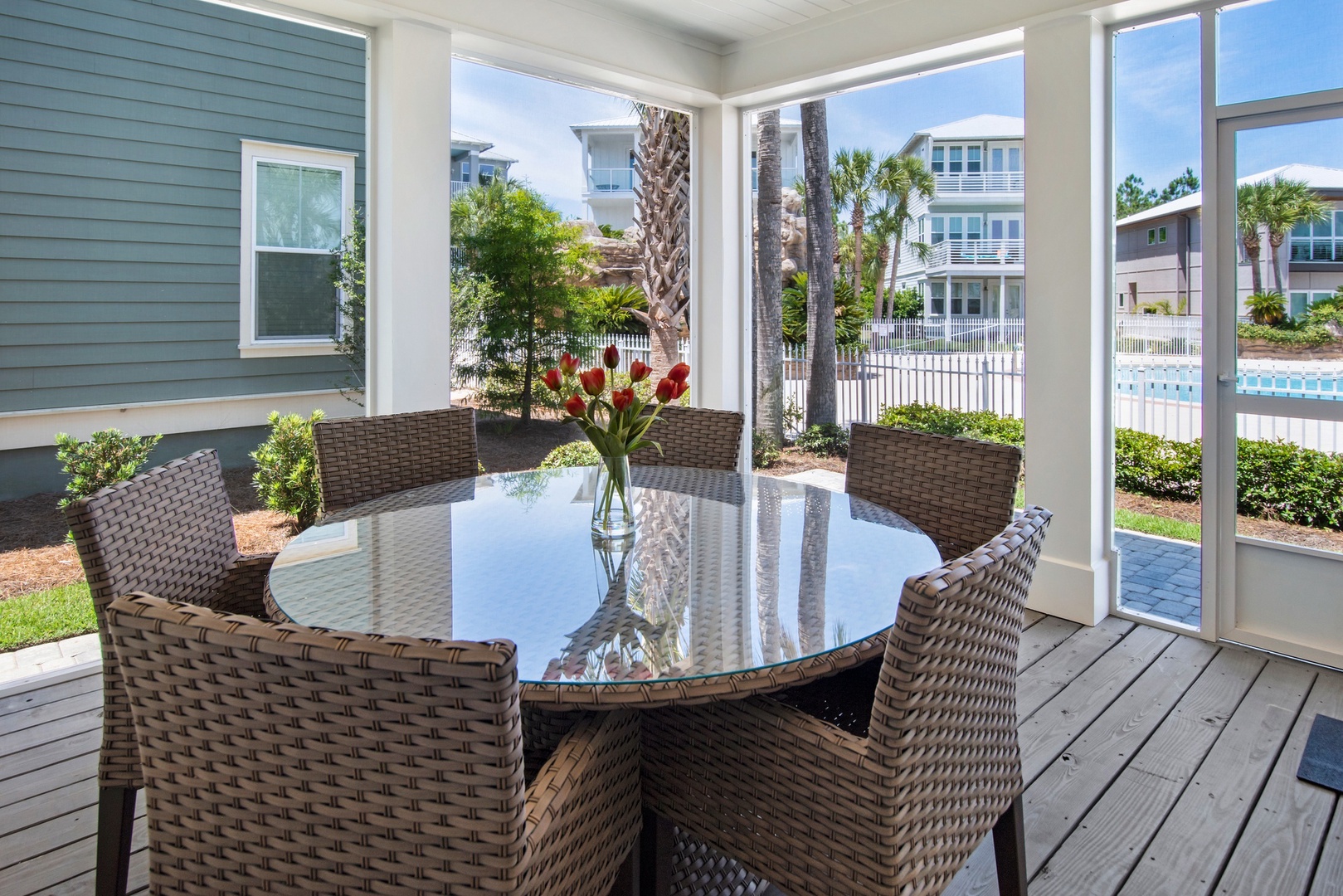 Enjoy meals out in the breezy screened porch with pool views!