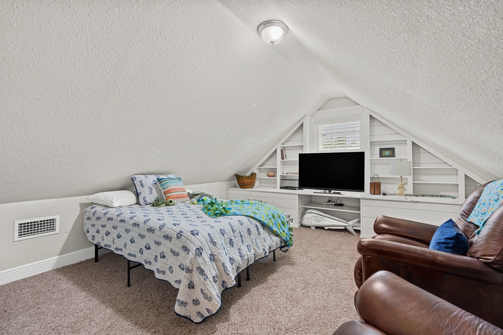 The loft includes a full bed, flat screen TV and leather lounge chairs!