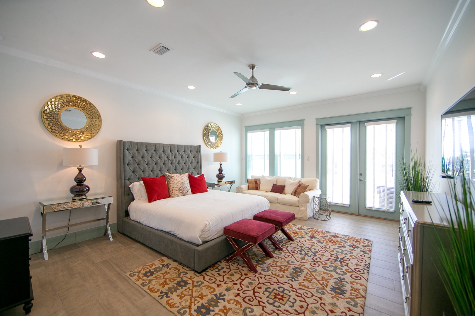 The luxurious master bedroom offers views of the pool & features a huge walk in closet and en suite bathroom!