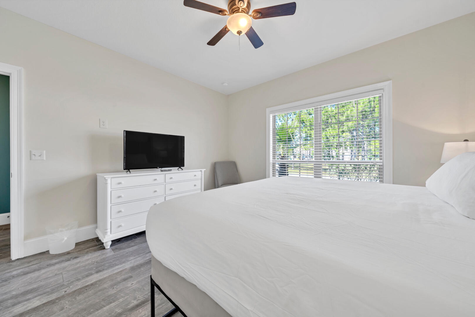 The guest bedroom features a king size bed and plentiful light!