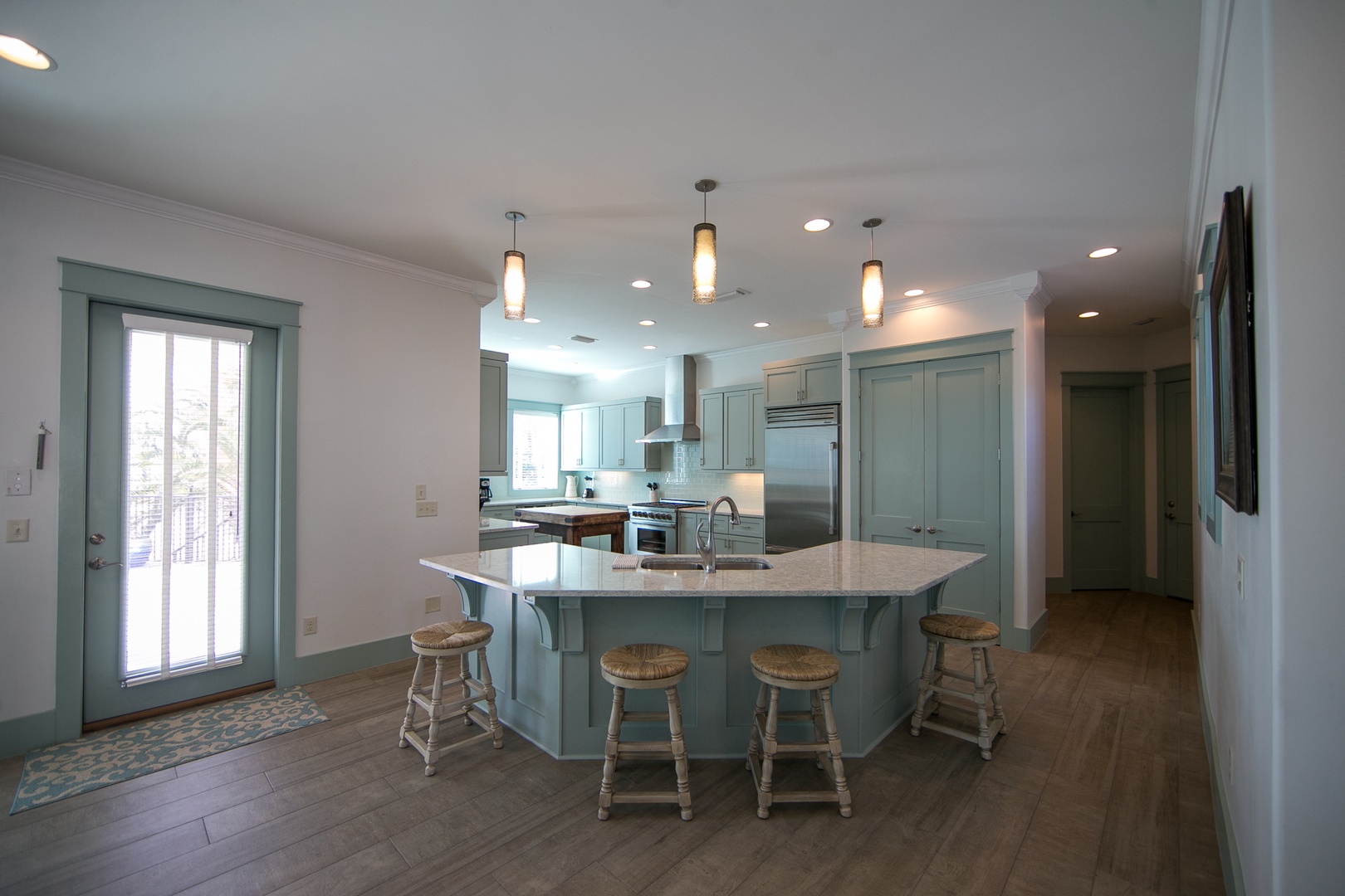 The kitchen island is great for additional seating!