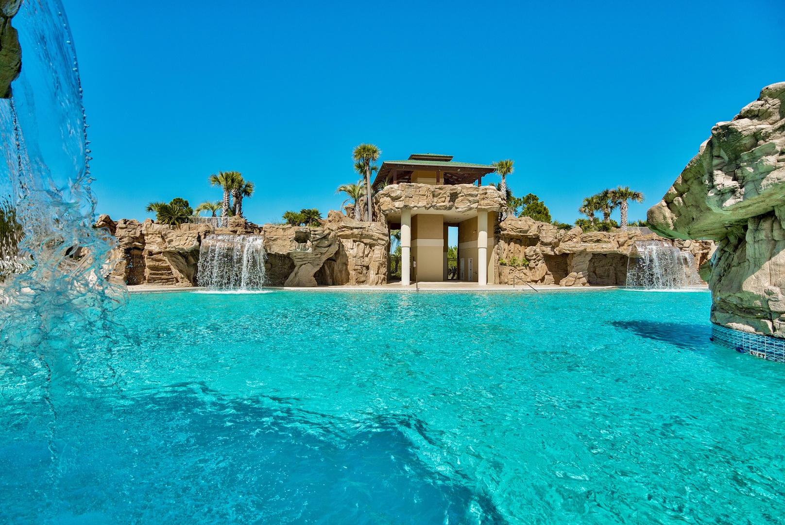 The amazing neighborhood pool features grottos, waterfalls, and more!
