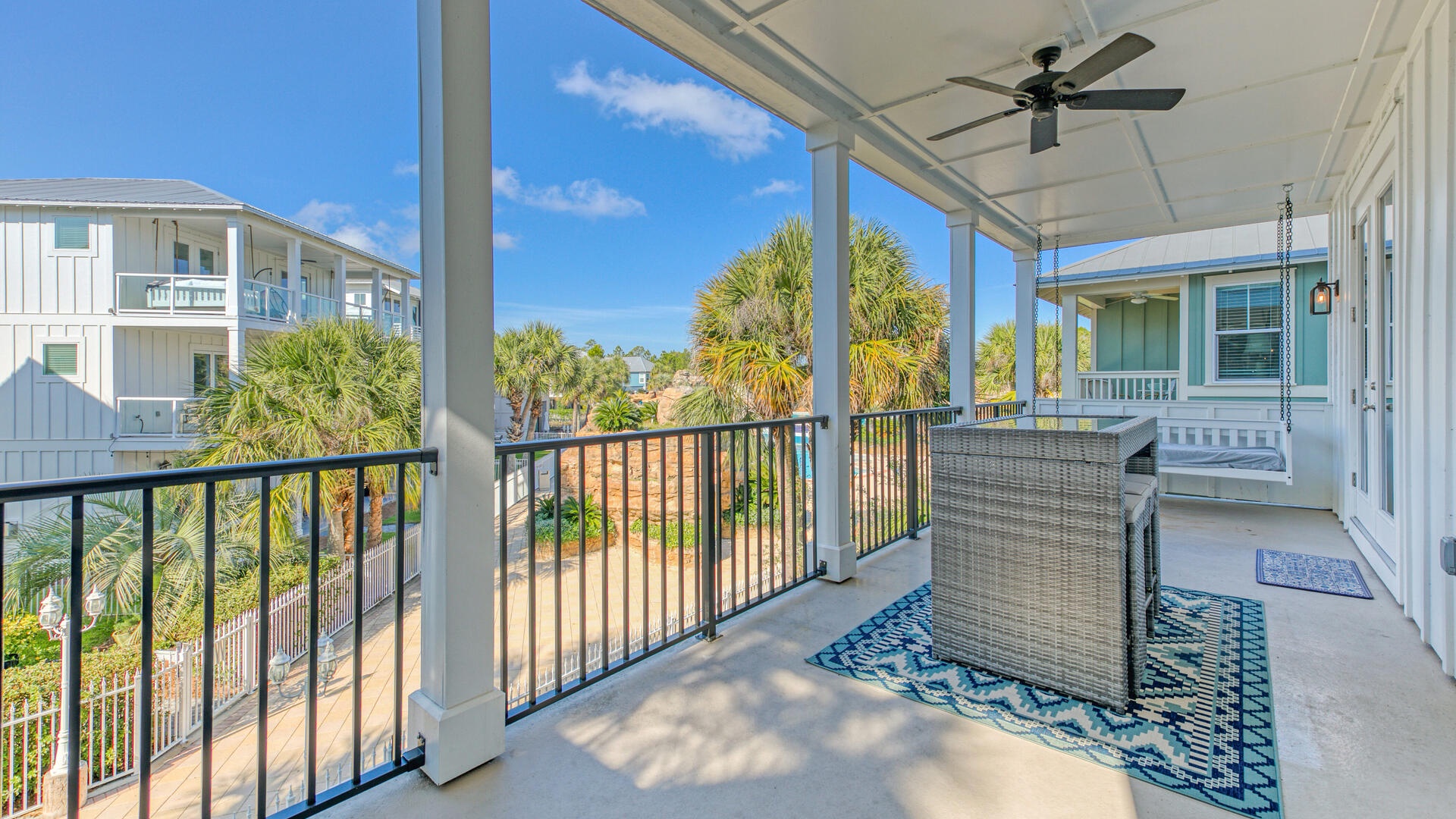 The living/kitchen balcony includes a large BBQ grill and high-top table!
