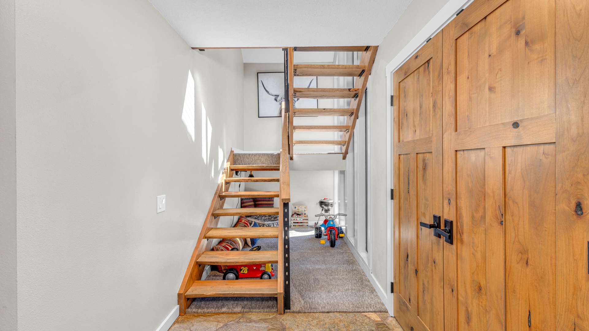 Front entry with kids toys and staircase