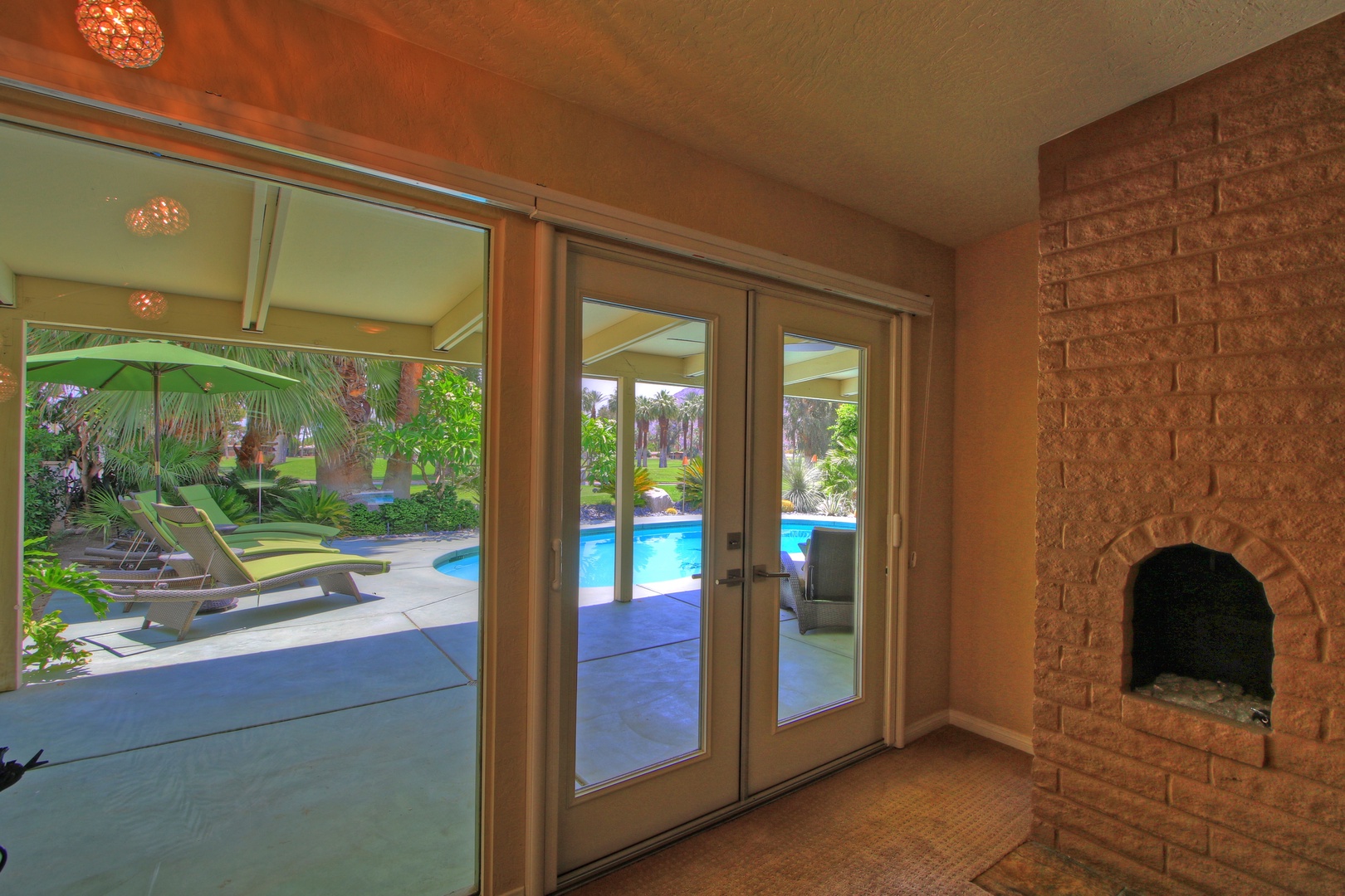 Primary Bedroom Steps Out to Poolside Patio
