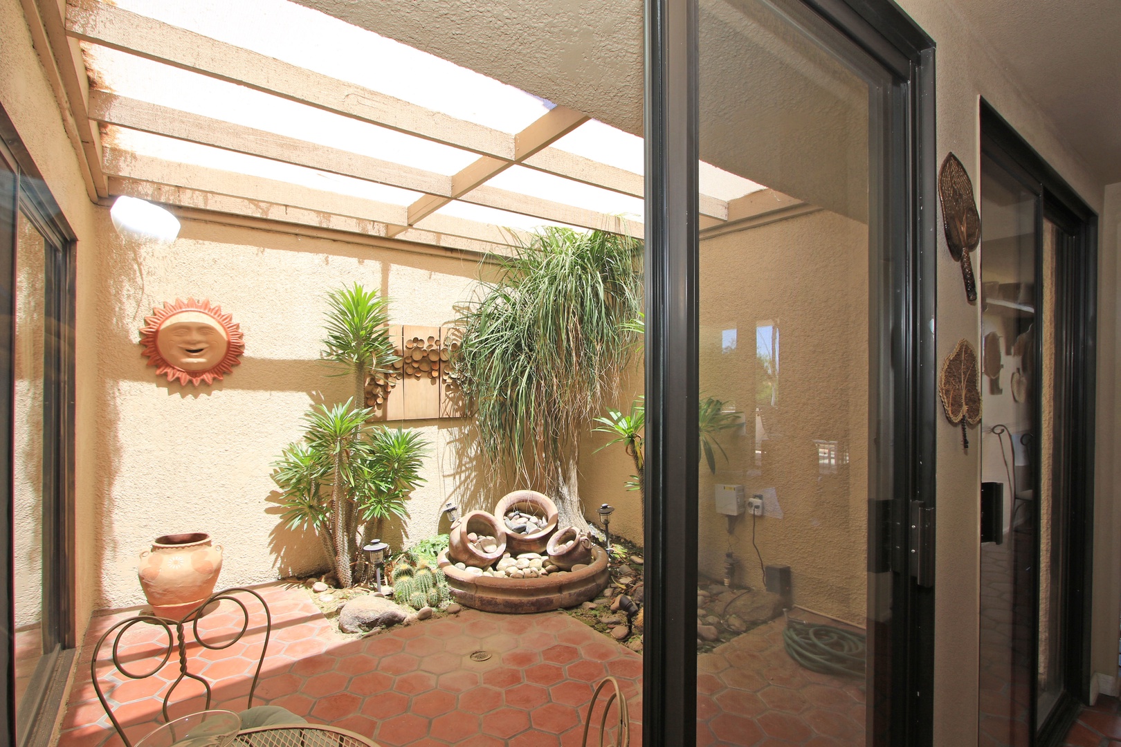 Sunny Atrium adds Natural Light to Living Area