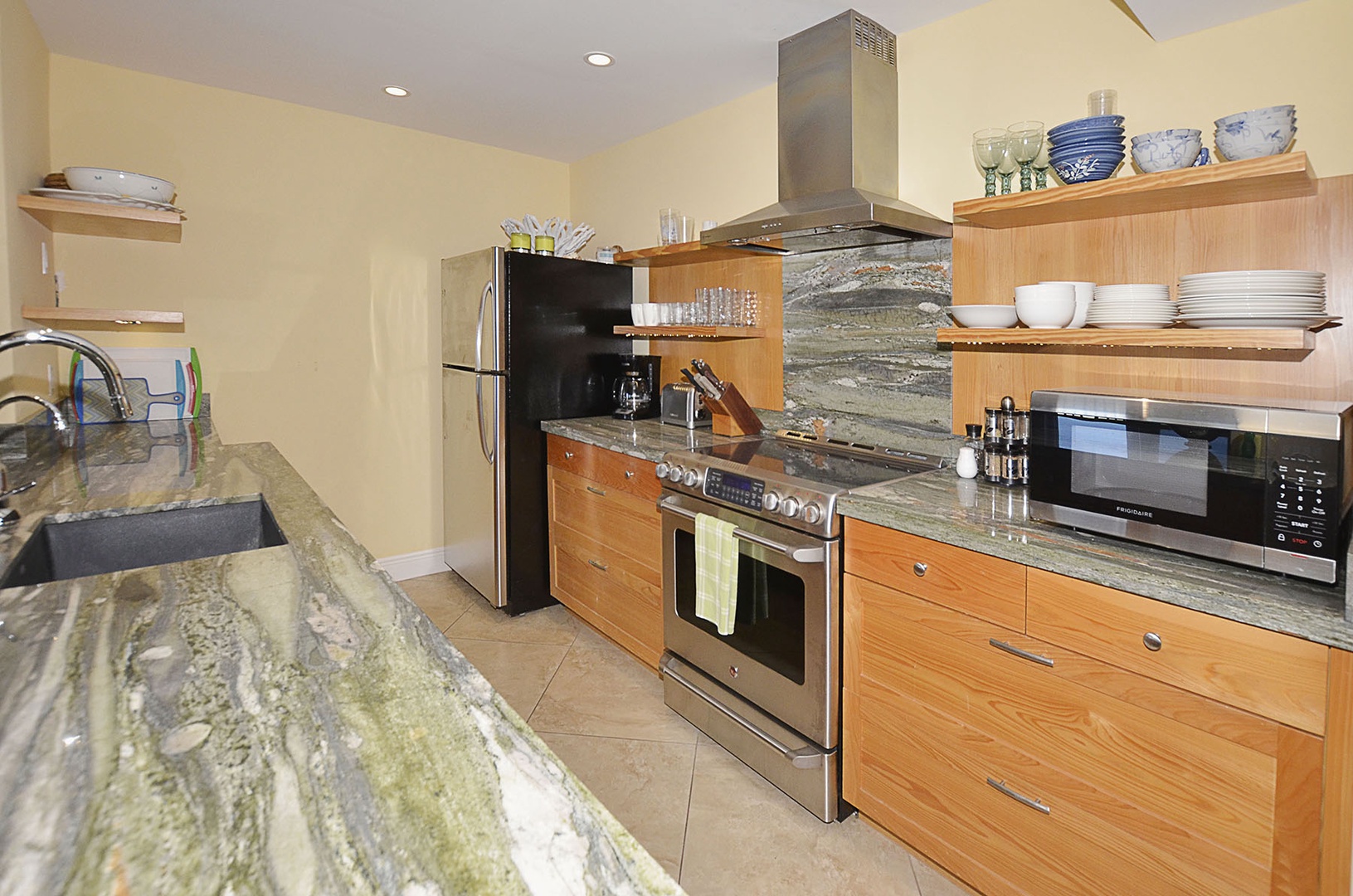 Kitchen with custom stainless steel appliances