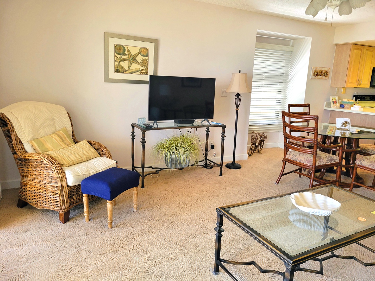 Your bright living space features comfortable seating, entertainment center, and open layout connecting to your fully equipped kitchen.