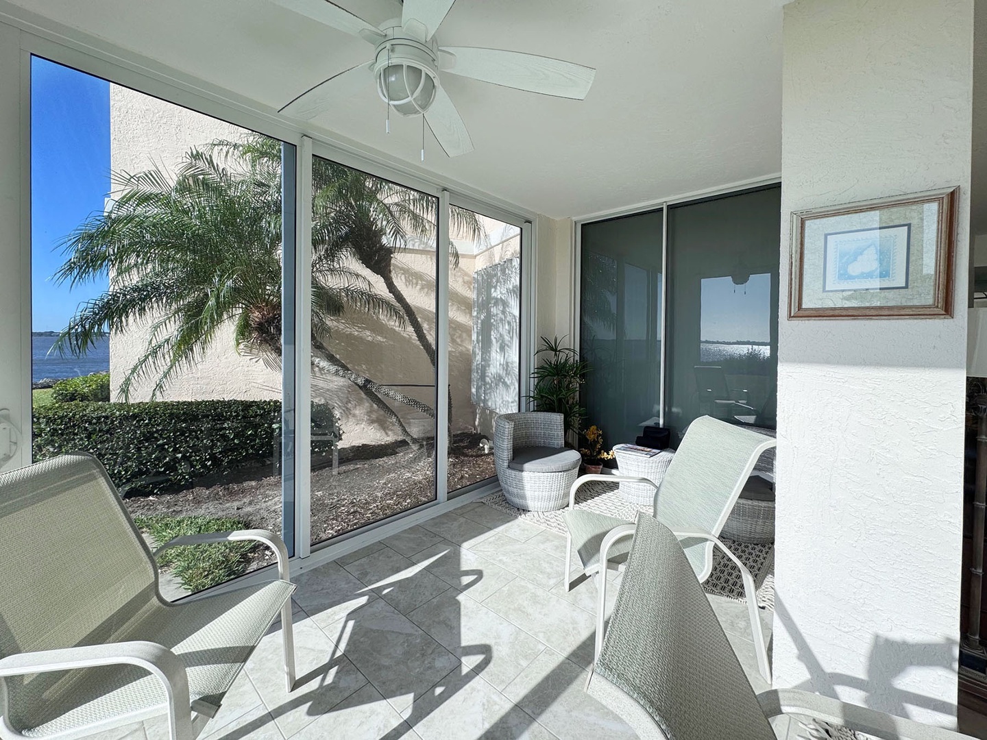 Your screened Patio Lanai, directly off the Primary Bedroom, offers peaceful relaxation with tropical garden views, ceiling fan comfort, and coastal Florida charm.