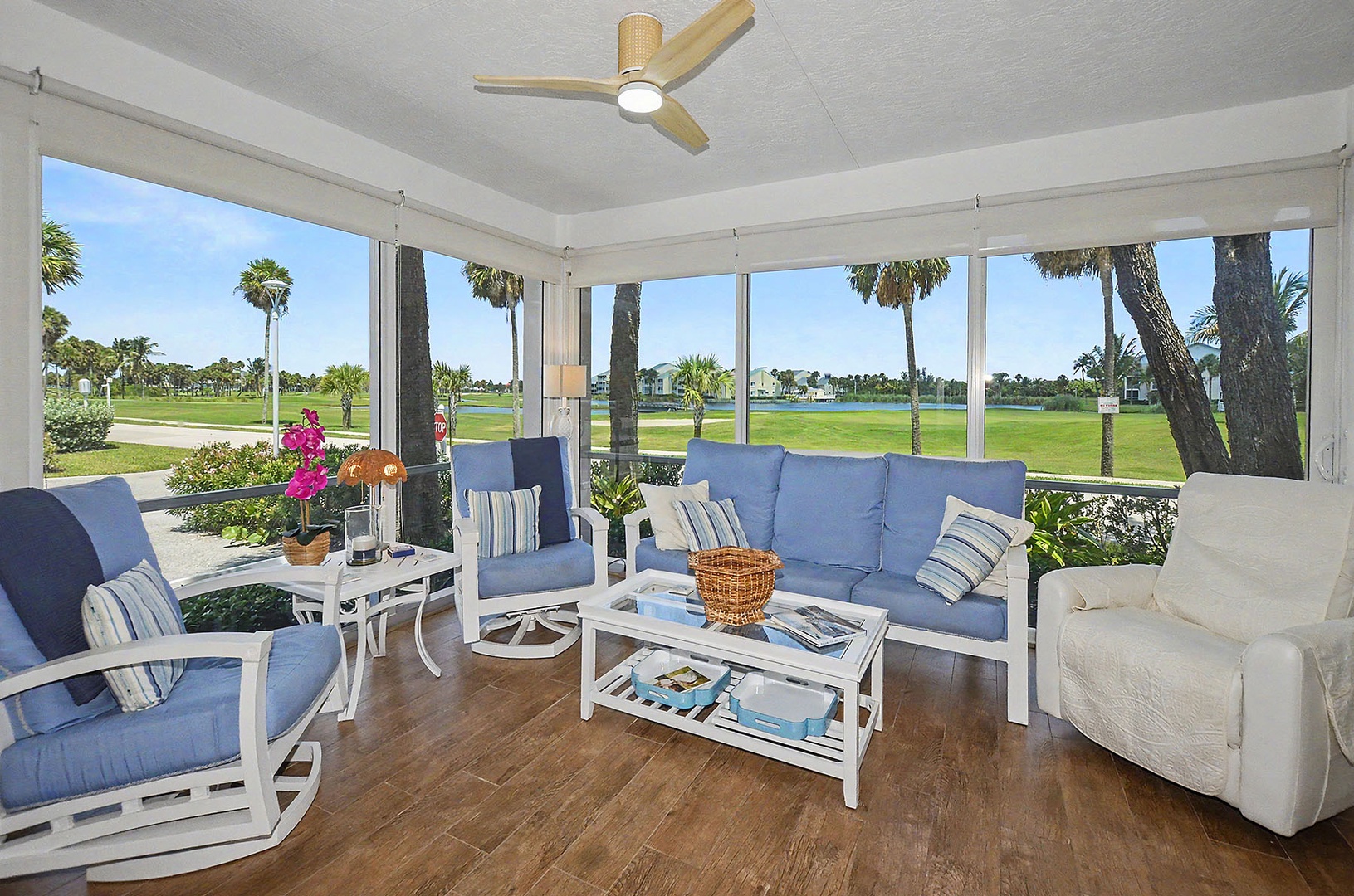 Screened patio overlooking the golf course fairway.