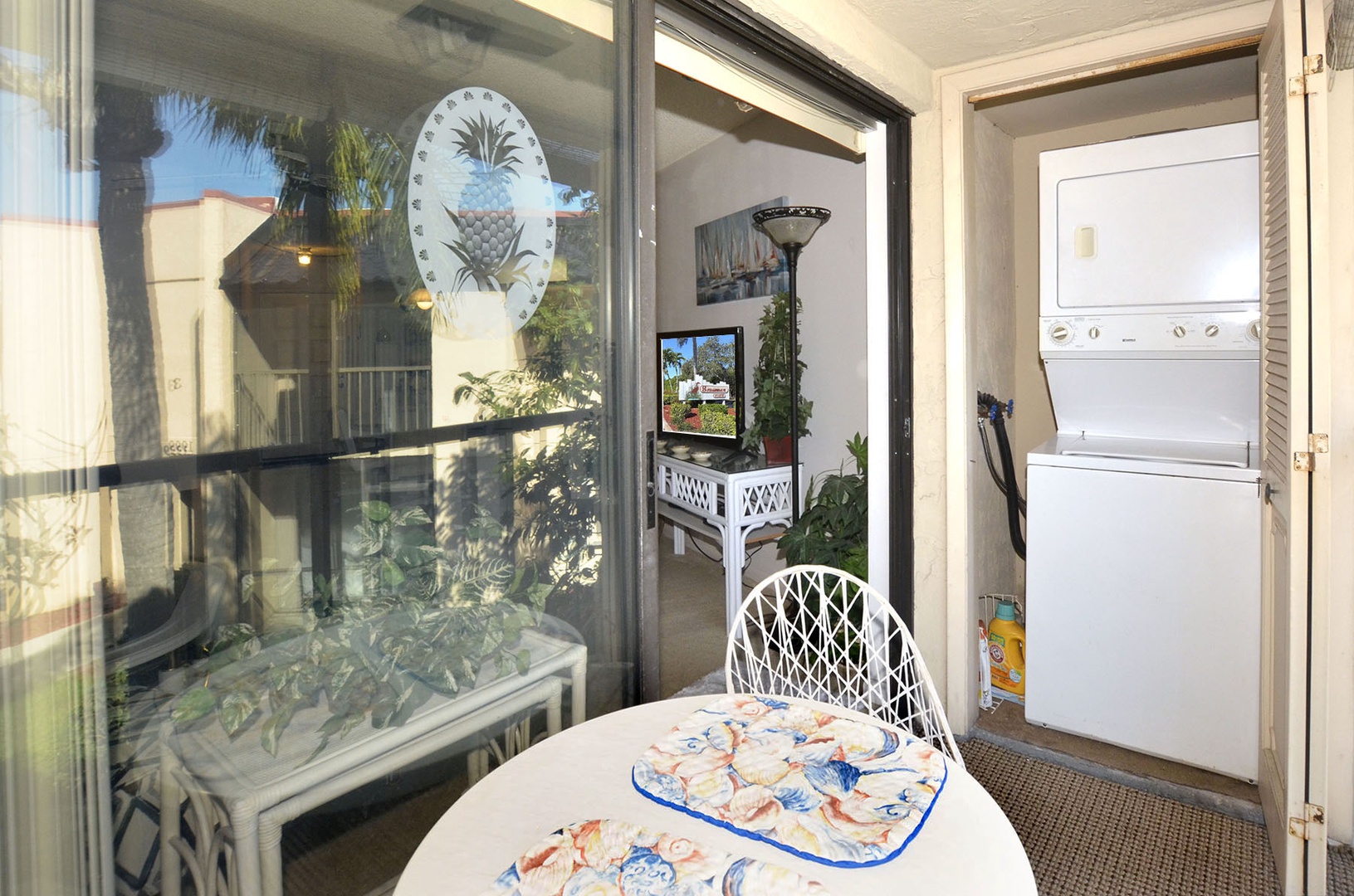 Your charming breakfast nook features tropical décor and convenient laundry access, perfect for starting each day in comfort.